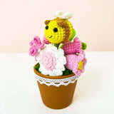 Crochet pink flowers with bee