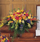 Celebration of Life Casket Spray of vibrant flowers