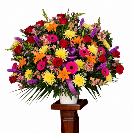 Garden floral funeral basket with red, yellow, orange and pink flowers
