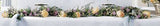 Deluxe funeral casket garland with peach roses and greens