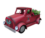 Succulents in red Christmas tree truck planter