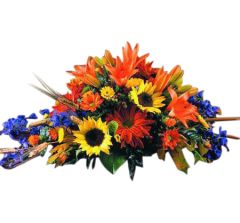 Fall flower centerpiece with sunflowers and lilies in yellow, orange and blue