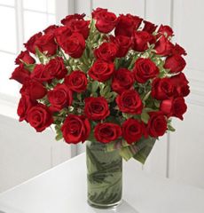 Fate luxury flower arrangement of red roses in cylinder vase