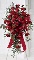 Funeral flower standing spray of red roses and red carnations