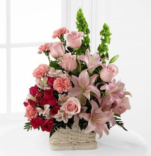 Beautiful spirit sympathy flower arrangement in basket with assorted pink flowers Small