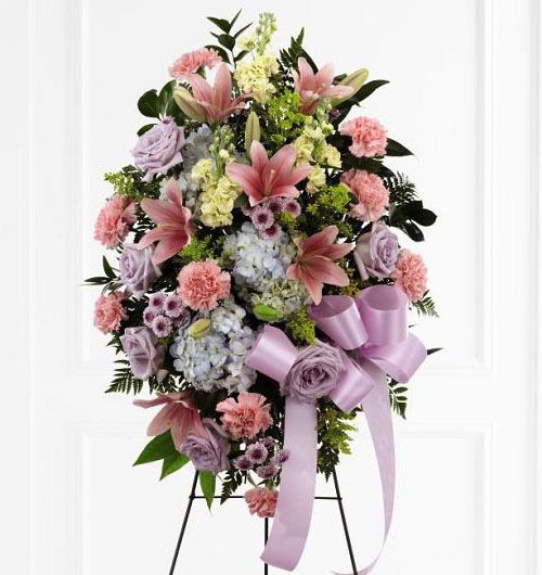 Blessings of the Earth funeral flower standing spray of pink lilies, blue hydrangea, carnations and stock Small