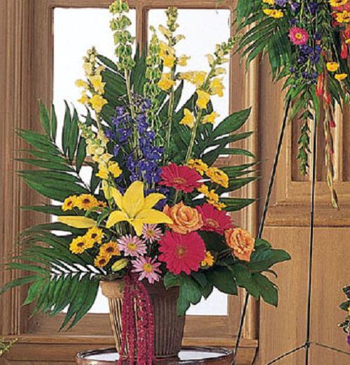 Celebration of Life Arrangement of vibrant flowers for funeral