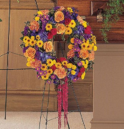 Celebration of Life funeral wreath of vibrant flowers