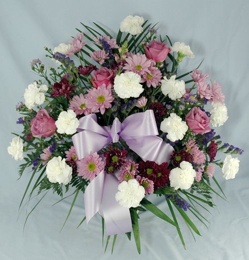 Condolences funeral flower basket of lavender, purple and white