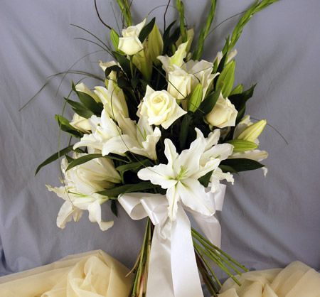 Elegant white lilies in a wrapped bouquet
