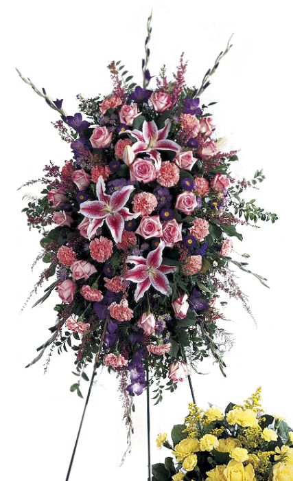 Funeral flower standing spray with assorted pinks and purples