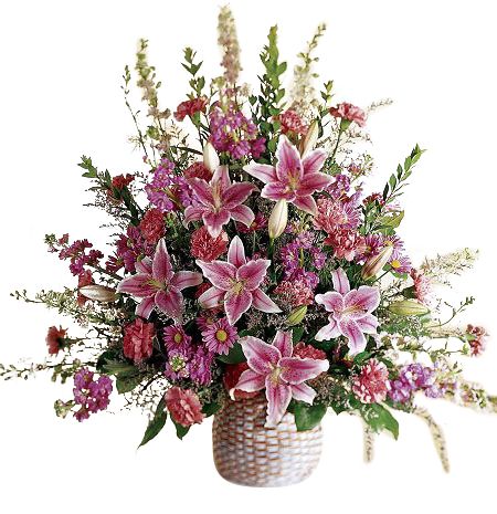 One sided funeral flower arrangement of assorted pink flowers with stargazer lilies