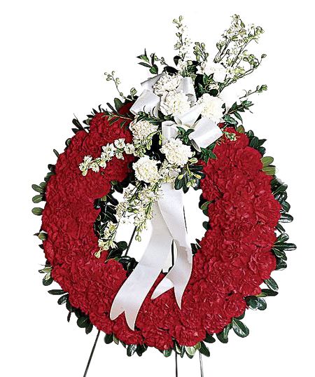 Patriotic tribute wreath of red and white flowers for funeral