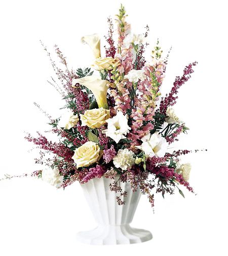 One sided funeral flower arrangement of cream and pink flowers