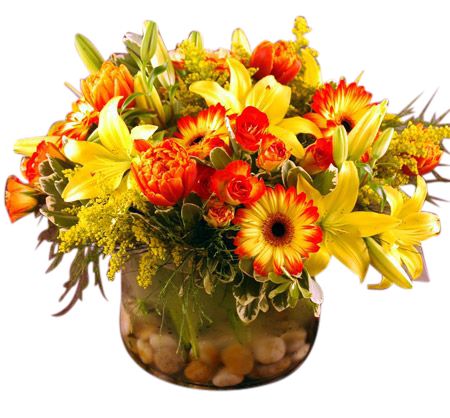 Glass cylinder vase filled with vibrant yellow and orange flowers