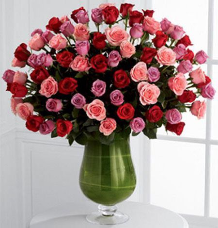 Heartfelt luxury flower arrangement in urn vase with assorted pink, lavender and red roses