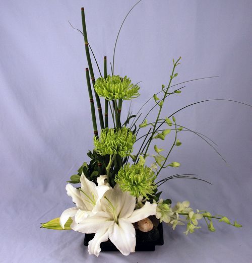 Isle of Beauty tropical flower arrangement with white lily and orchid