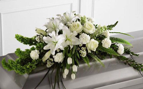 Resurrection funeral flower casket spray of assorted white flowers Small