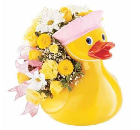 Whimsical yellow duck container with fresh flowers for new baby