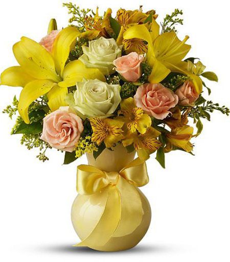 Teleflora sunny smiles bouquet of assorted yellow flowers in a yellow vase with bow