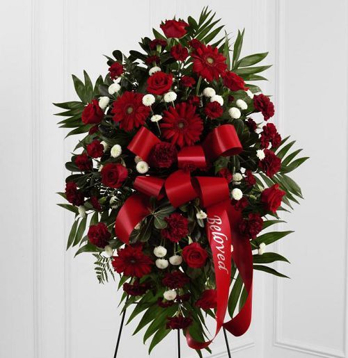 Red and white funeral flower standing spray with red bow Small