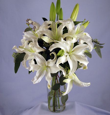 White oriental lilies in a wrapped bouquet