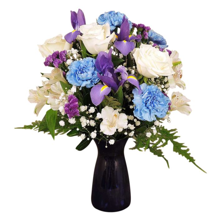 Blue and white fresh flowers in a blue glass vase Large