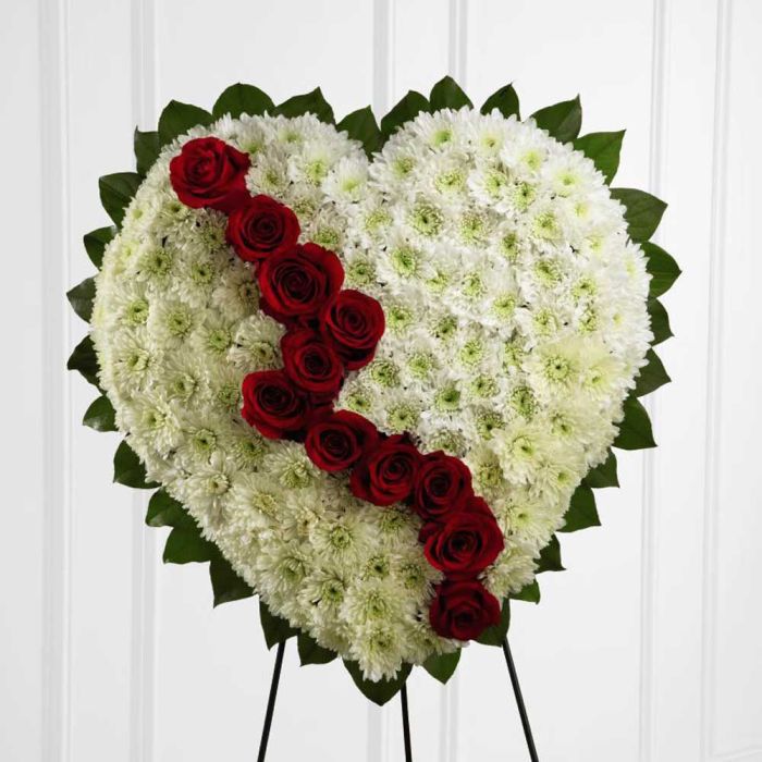 Funeral flower broken heart with red roses