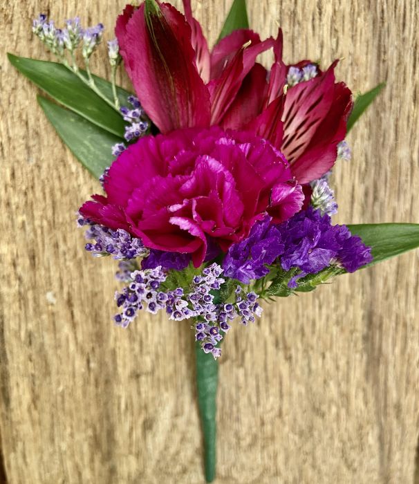 Assorted purple flower boutonniere