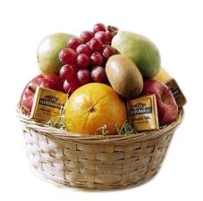Assorted seasonal fruit in wicker basket