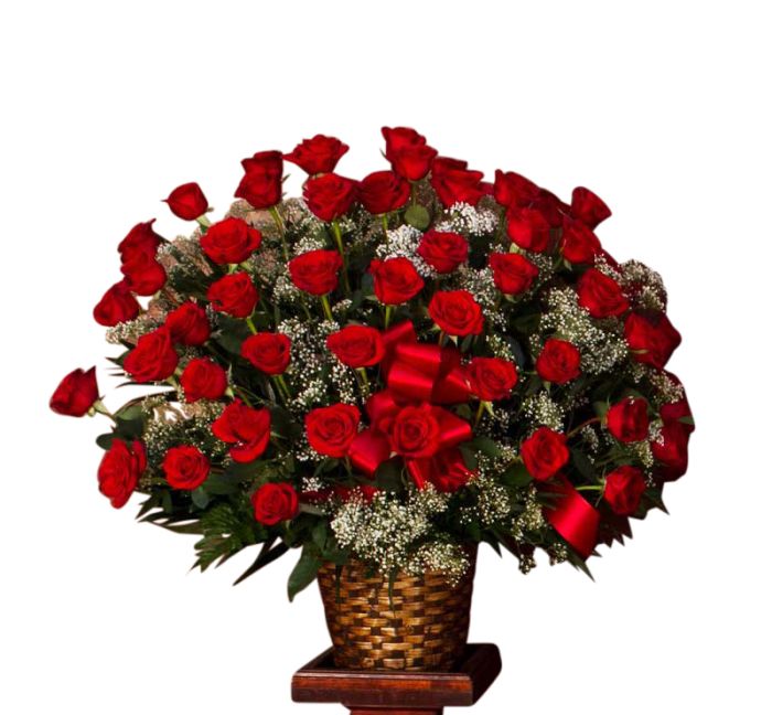 Red roses arranged in a basket for a funeral service