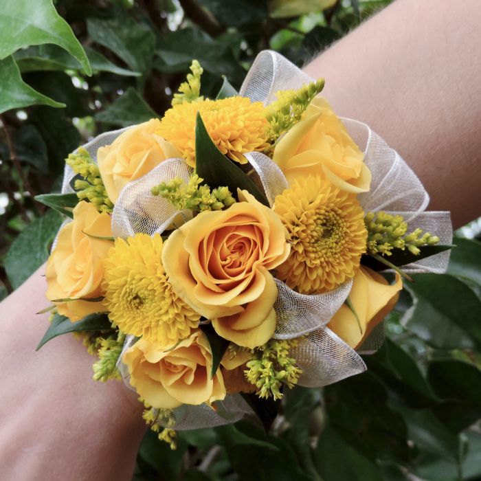 Wristlet corsage of yellow spray roses