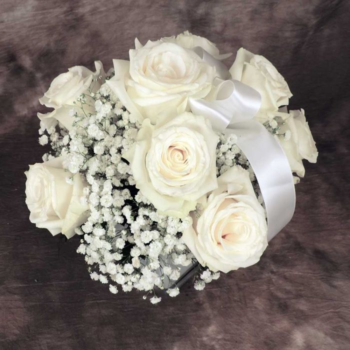 Top of white rose and babies breath cube bouquet